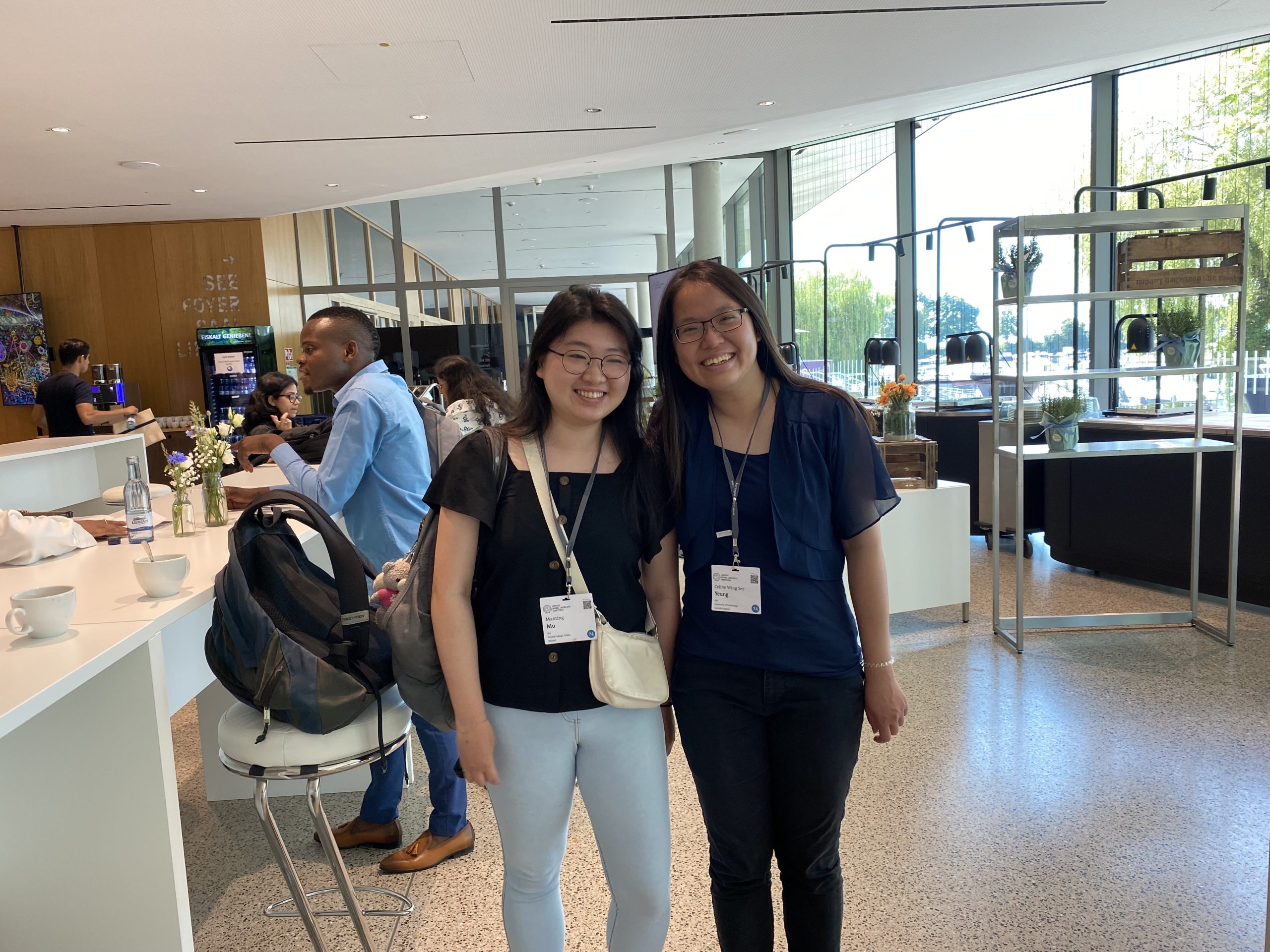 Two women stand together for photo