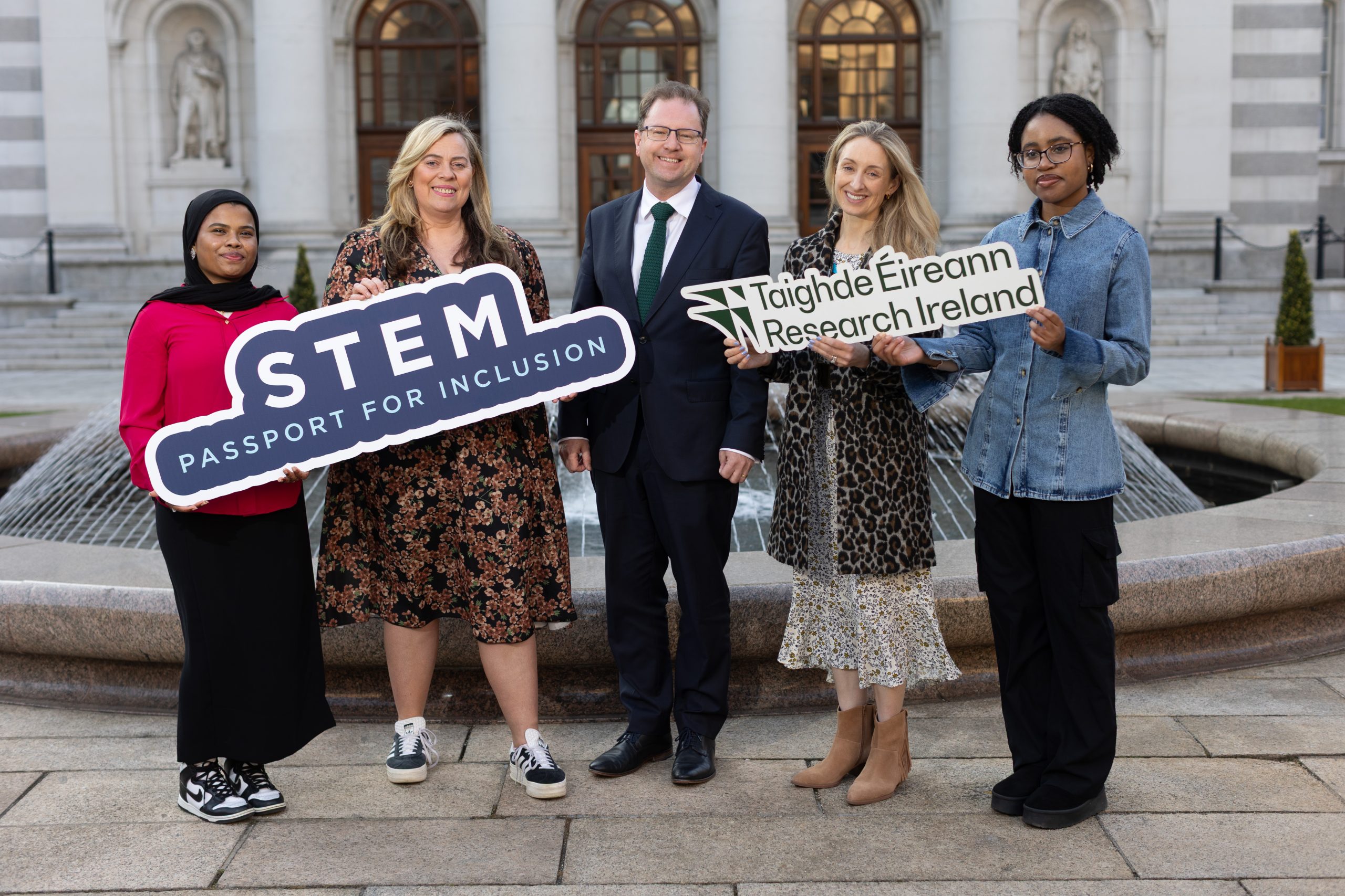 Sumaya Jerin (STEM Passport graduate), funding awardee Prof. Katriona O’Sullivan (Maynooth University, and All-Ireland STEM Passport for Inclusion Project Lead), Minister for Further and Higher Education, Research, Innovation and Science, James Lawless TD, Dr Ruth Freeman, Director of Research for Society at Research Ireland, and Peri-Elki Manyi Tiendioh (STEM Passport graduate).