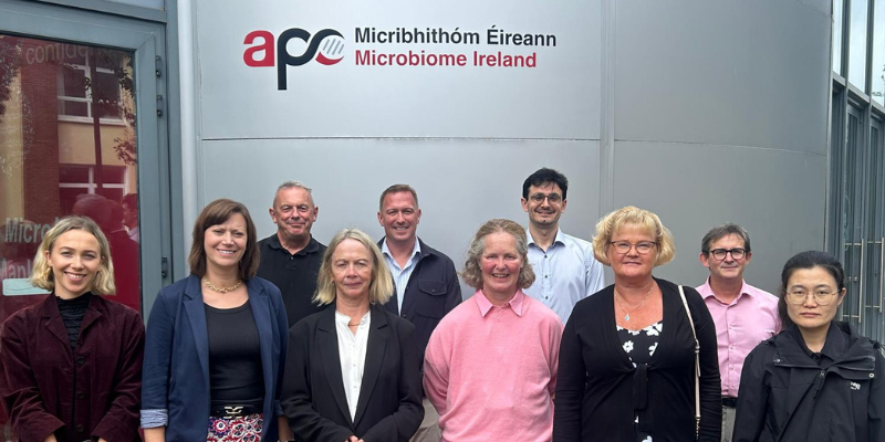 A group photo outside APC Microbiome Ireland. Named from left to right: APC Researcher at UCC, Dr Ashley Hibbert - Human Microbiomics Platform Lead at IFF, Prof Paul Ross – Director at APC at UCC, Prof Catherine Stanton –  Senior Principal Research Officer at Teagasc Moorepark, Dr. Charles Budinoff - Strain Discovery and Microbiome Science Lead at IFF, Carol Ann O’Shea – APC Nurse at UCC, Dara Hedayatpour – APC Researcher at UCC, Dr Johanna Maukonen - Global Director of Clinical Innovation & Translation at IFF, Prof Eugene Dempsey - Principal Investigator at The Infant Centre, UCC, Funded Investigator at APC, Consultant Neonatologist  at CUMH, Dr. Mengfan Ding – APC Researcher at UCC.