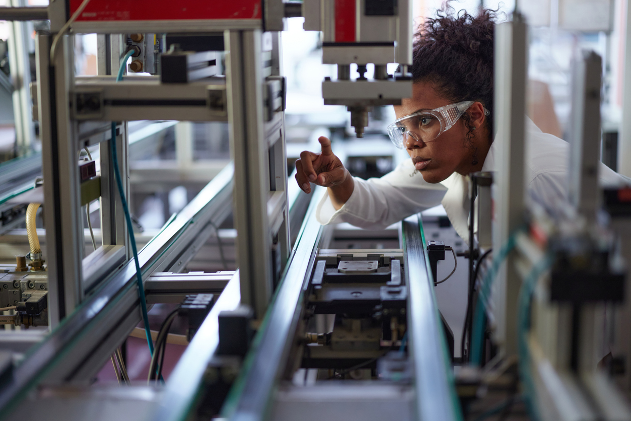 A scientist working on production line in laboratory