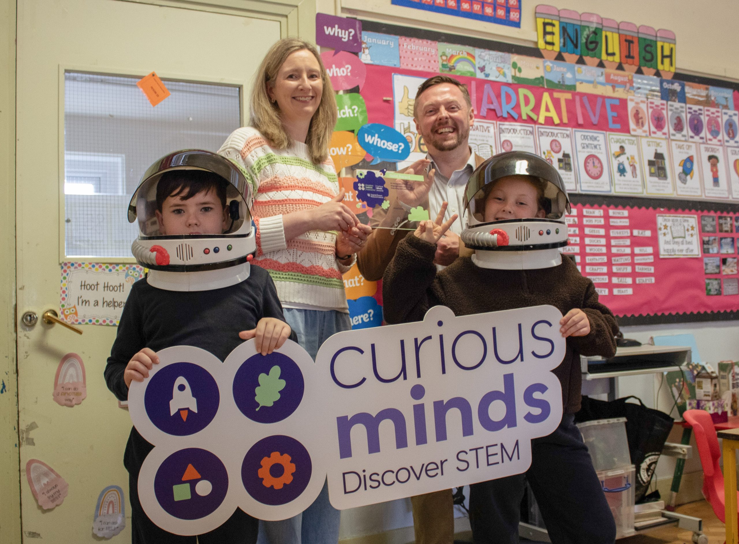 A picture of a group of people holding a curious minds sign at St Gabriel’s National School, Ballyfermot. Pictured at the school’s Gold Award presentation were (left-right): Preston, Maria Kelly (STEM Coordinator), Lottie and Brendan Owens (Programme Manager, Research Ireland).