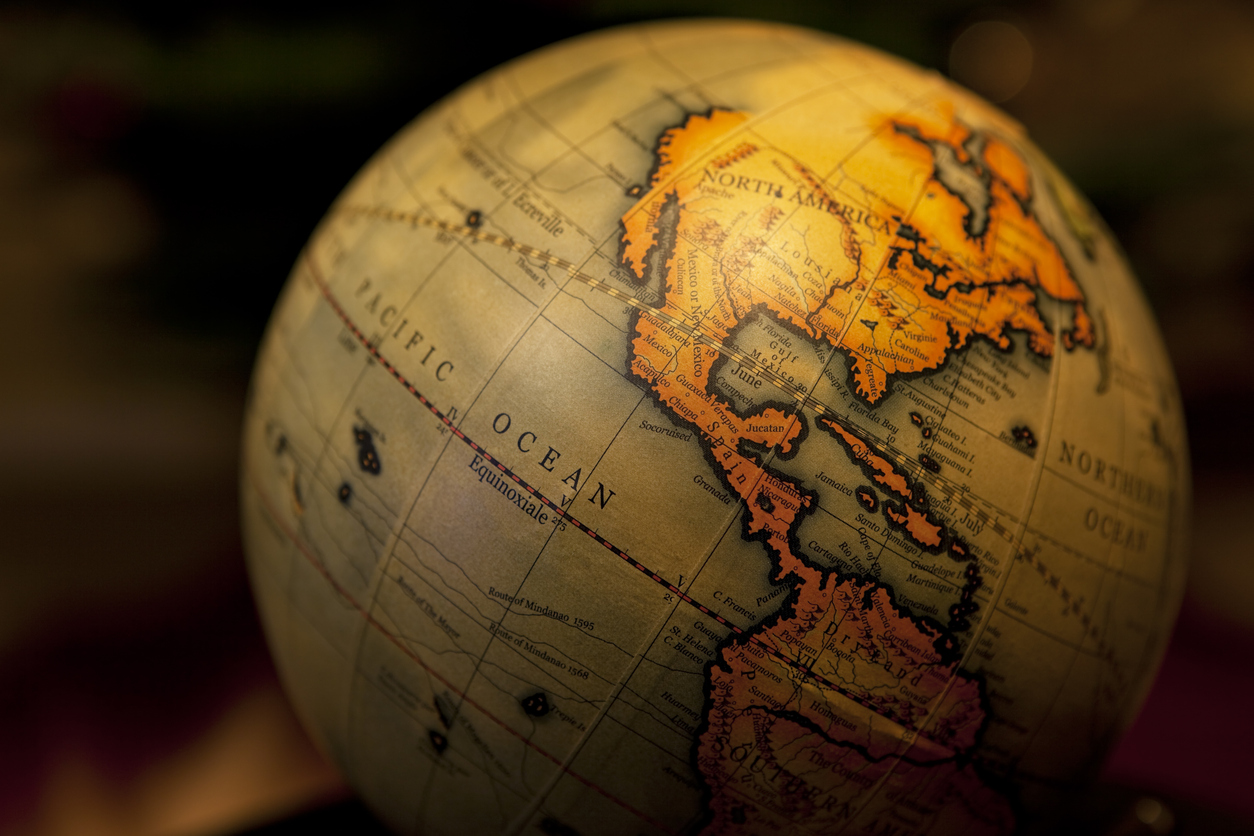 An image of a vintage globe showing the Americas.